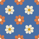 a repeating pattern of stylized flowers in shades of orange and white against a blue background.