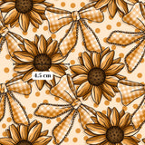 a repeating pattern of sunflowers with bows on a light brown background with polka dots.