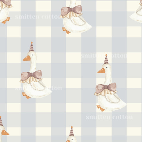 a repeating pattern of cartoon-style ducks wearing party hats and bow ties against a light blue and white checkered background.