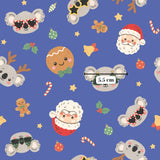 a pattern of various Christmas-themed characters and objects, including koalas, Santa Claus, gingerbread cookies, candy canes, and other festive elements. The overall color scheme is predominantly blue, with some red and green accents. The image is a collage of multiple smaller images, and the text "5.5 cm" is visible, indicating the size of the image.