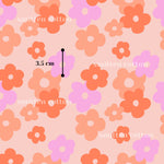 a repeating pattern of pink and orange flowers on a light pink background. The pattern is composed of various flower shapes, and there is a line of text indicating the size of the flowers in the center of the image, which is 3.5 cm.