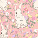 a pattern of cartoon rabbits surrounded by colorful flowers and leaves on a pink background.