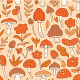 a bunch of mushrooms and leaves on a peach background