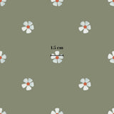 a repeating pattern of white flowers with red centers, all set against a green background.