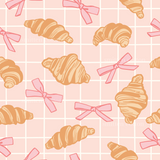 a pattern of croissants with pink bows