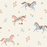 a pattern of horses and flowers, with a ruler indicating the size of the horses.