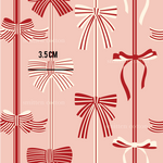 a red and white wallpaper with bows on it