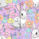 a repeating pattern of cartoon rabbits surrounded by colorful flowers and leaves. The rabbits are depicted in various poses, and the flowers and leaves are arranged in a visually appealing manner. The image does not contain any text or specific details about the rabbits or flowers, and it does not include any measurements or descriptions.