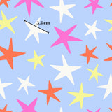 a pattern of colorful stars on a blue background, with a measurement line indicating the size of the stars.