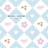 The image is a repeating pattern of various shapes and objects, including flowers, hearts, and bows, arranged in a diamond-like pattern. The image is described as a "repeating pattern" and "repeating design" and includes a scale for size reference.