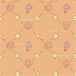 a pink flower pattern on an orange background