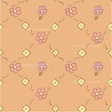 a pink flower pattern on an orange background