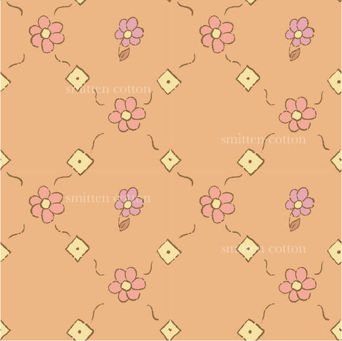 a pink flower pattern on an orange background