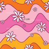 a pink and orange background with white flowers