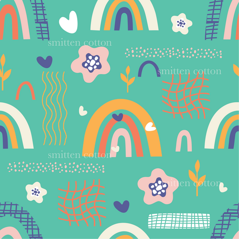 a pattern of rainbows and clouds on a blue background