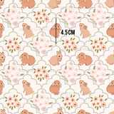 a pattern of rabbits and flowers on a white background