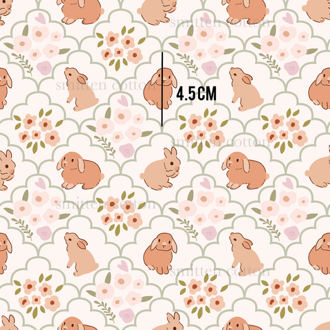 a pattern of rabbits and flowers on a white background