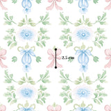 The image is a repeating pattern of blue flowers with green leaves and pink bows, with a measurement line indicating the size of the pattern.