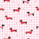 a repeating pattern of dachshund dogs wearing red heart-shaped sweaters against a pink and white checkered background.