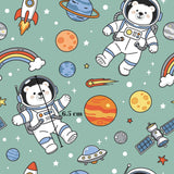 The image is a seamless pattern featuring a space theme with various celestial objects and characters, including a polar bear astronaut, a rainbow, a rocket ship, a planet, a satellite, and a shooting star.