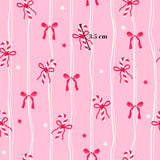 a repeating pattern of pink and white stripes with red and white bows and candy canes.