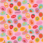 a pink background with a bunch of fruit on it