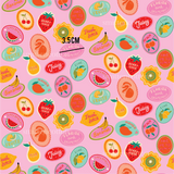 a pink background with a bunch of fruit on it