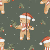 a repeating pattern of gingerbread men wearing Santa hats and scarves, along with Christmas decorations such as pine branches and ornaments.