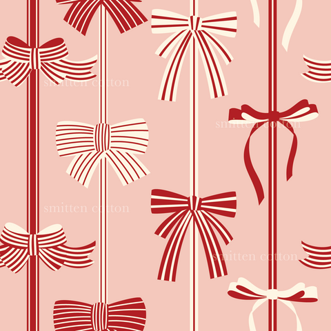 a red and white bow pattern on a pink background