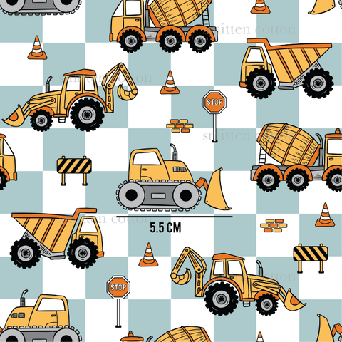 a pattern of construction vehicles on a checkered background