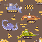 a repeating pattern of various cartoon-style construction vehicles and dinosaurs, including bulldozers, excavators, and triceratops, all set against a brown background with yellow and black accents.