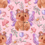 The image is a repeating pattern featuring a cute brown bear with wings, flowers, mushrooms, and butterflies against a pink background.
