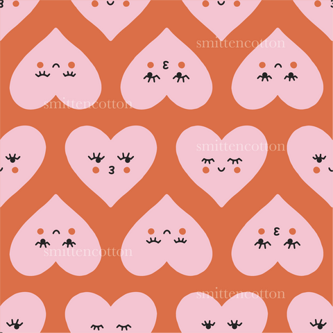 a pattern of hearts with faces on a pink background