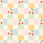 a checkered pattern with cherries on it