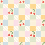 a checkered pattern with cherries on it