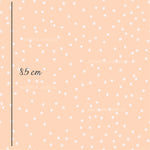 a pink background with white polka dots