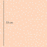 a pink background with white polka dots