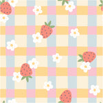 a pattern of strawberries and daisies on a checkered tablecloth