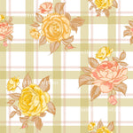 a repeating pattern of yellow and pink roses against a white and green checkered background.