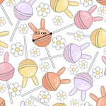 a repeating pattern of colorful lollipops and flowers on a white background.