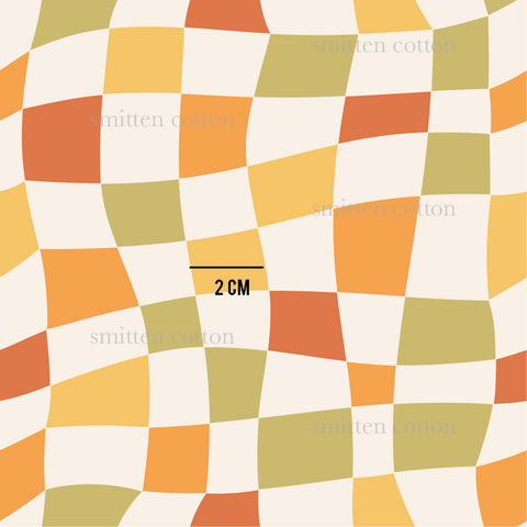 an orange and yellow checkered pattern with the word 2cm