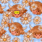 a repeating pattern of cartoon cow heads with large horns and flowers on their faces, set against a blue background.