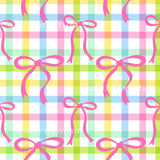 a repeating pattern of pink bows against a colorful, checkered background.