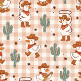 a repeating pattern of cartoon ducks wearing cowboy hats and bandanas, along with cacti and stars, creating a whimsical and playful design.
