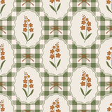 The image is a seamless pattern featuring a repeating design of oval frames containing orange flowers and green checkered borders.