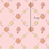 a pink background with a flower pattern on it