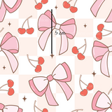 a pink bow and cherries pattern on a white background