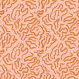 an orange and pink pattern on a pink background