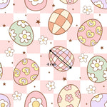 a pattern of colorful Easter eggs and flowers on a pink and white checkered background.