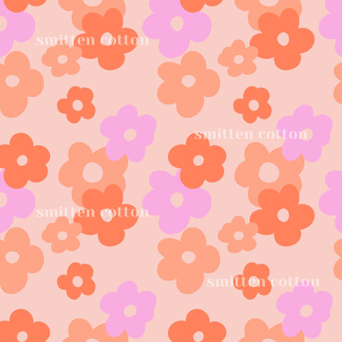 a repeating pattern of various colored flowers, including pink, orange, and purple, against a light pink background.